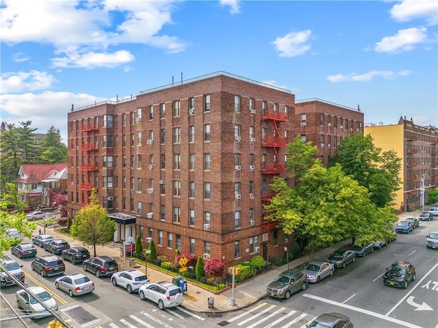 1680 Ocean Ave Unit 4H, Brooklyn, NY 11230 - view of apartment building / complex featuring uncovered parking