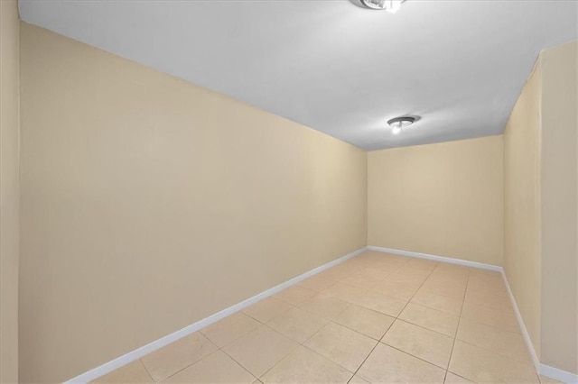 628 Thomas S Boyland St, Brooklyn, NY 11212 - spare room featuring light tile patterned flooring and baseboards