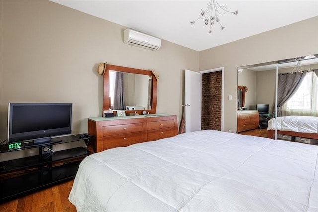 2077 E 22nd St, Brooklyn, NY 11229 - bedroom featuring an AC wall unit, wood finished floors, and a chandelier