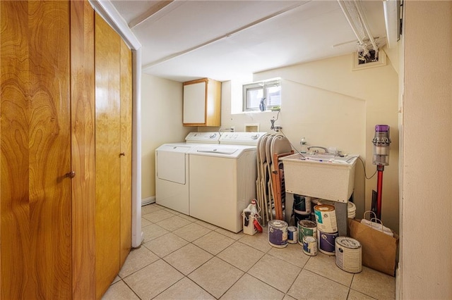 2077 E 22nd St, Brooklyn, NY 11229 - laundry area with separate washer and dryer, cabinet space, and light tile patterned flooring