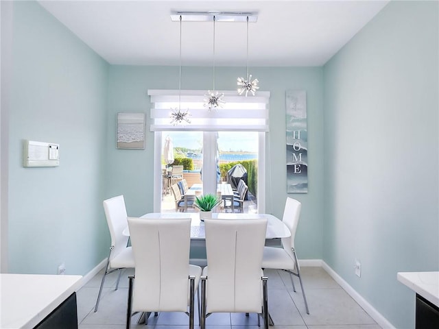 139 Tennyson Dr, Staten Island, NY 10308 - dining space featuring a chandelier, baseboards, and light tile patterned floors