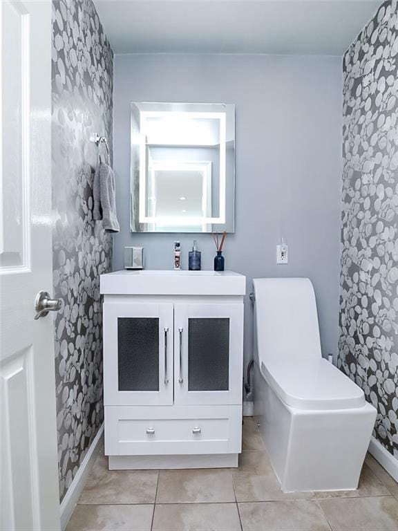 139 Tennyson Dr, Staten Island, NY 10308 - bathroom with vanity, toilet, tile patterned flooring, and baseboards