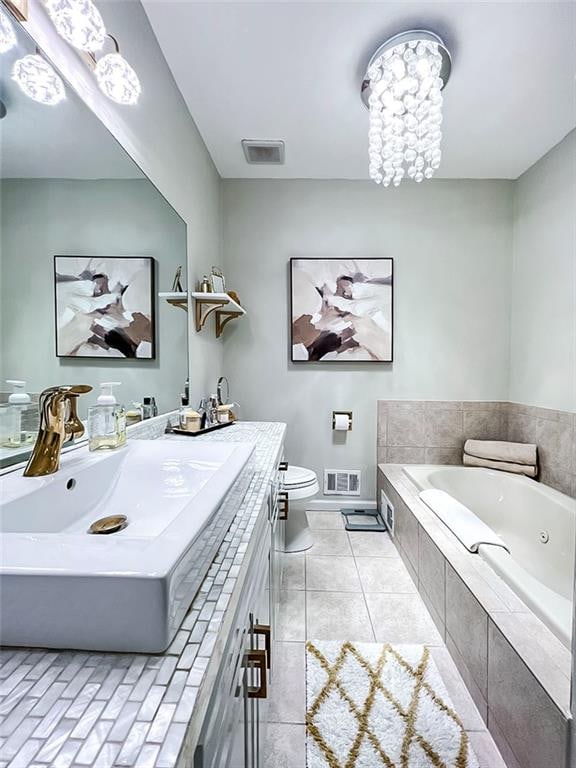 139 Tennyson Dr, Staten Island, NY 10308 - bathroom featuring a jetted tub, vanity, toilet, baseboards, and tile patterned flooring