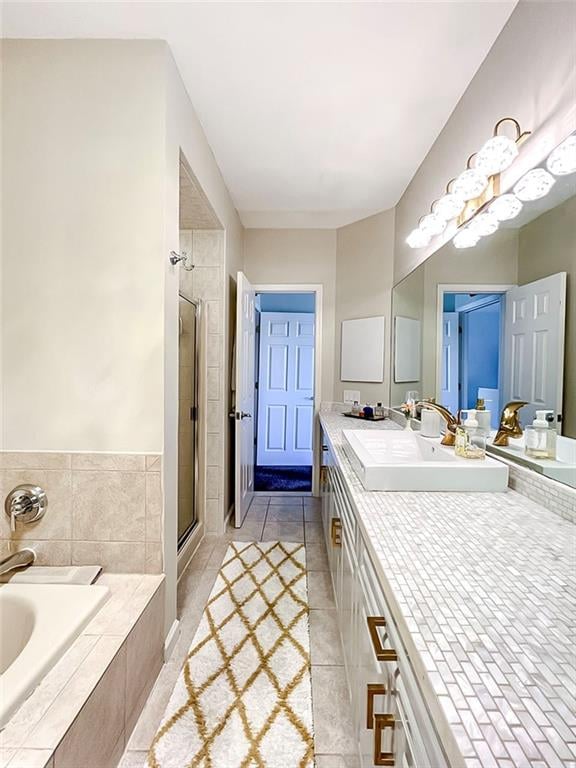 139 Tennyson Dr, Staten Island, NY 10308 - bathroom featuring a stall shower, a bath, vanity, and tile patterned flooring
