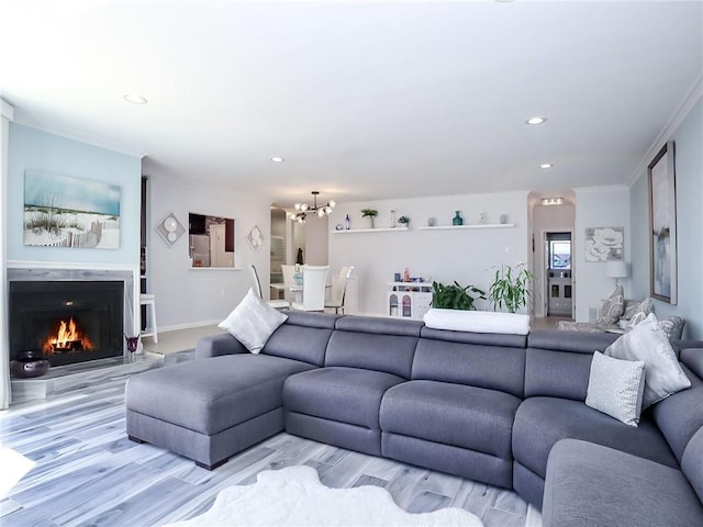 139 Tennyson Dr, Staten Island, NY 10308 - living room featuring a chandelier, recessed lighting, light wood-style flooring, a lit fireplace, and baseboards