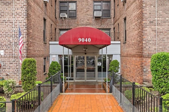 9040 Fort Hamilton Pkwy Unit 2I, Brooklyn, NY 11209 - doorway to property with brick siding and cooling unit