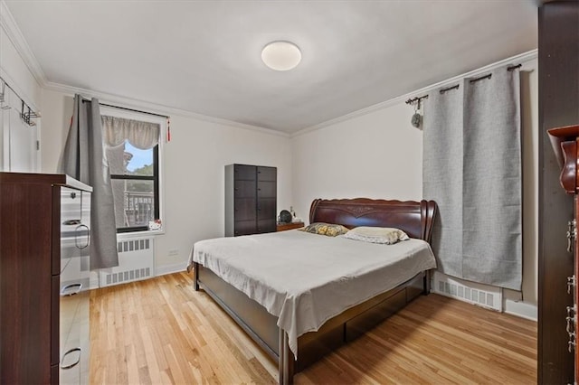 9040 Fort Hamilton Pkwy Unit 2I, Brooklyn, NY 11209 - bedroom featuring radiator heating unit, ornamental molding, light wood-style flooring, and baseboards