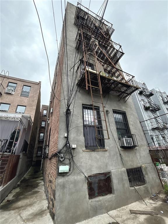 537 56th St, Brooklyn, NY 11220 - view of home's exterior featuring stucco siding