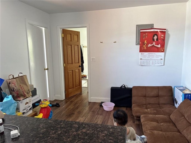 537 56th St, Brooklyn, NY 11220 - living area with dark wood-style floors and baseboards