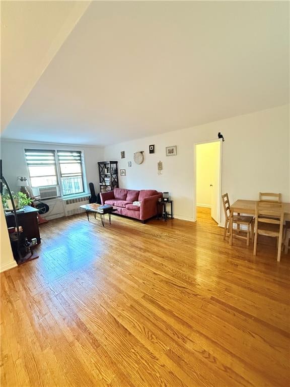 9511 Shore Rd Unit 617, Brooklyn, NY 11209 - living room with light wood-type flooring and cooling unit