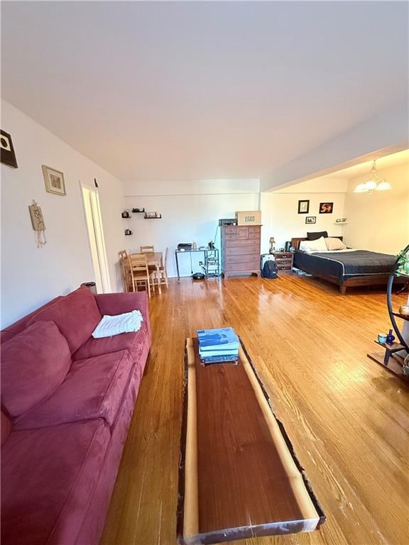 9511 Shore Rd Unit 617, Brooklyn, NY 11209 - living room featuring wood finished floors and a chandelier