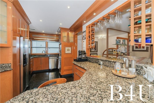 2544 E 64th St, Brooklyn, NY 11234 - kitchen with stainless steel appliances, brown cabinetry, a sink, granite floors, and glass insert cabinets