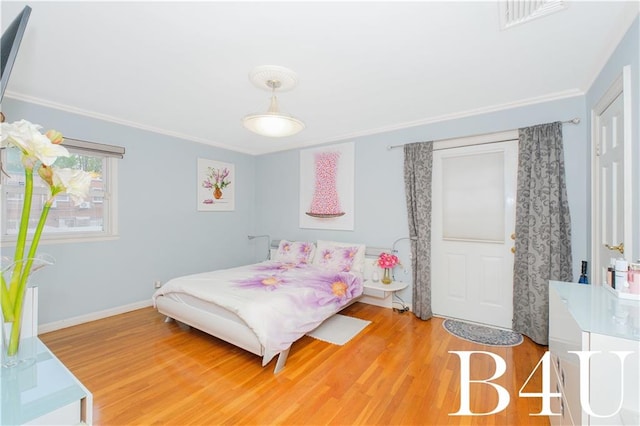 2544 E 64th St, Brooklyn, NY 11234 - bedroom featuring wood finished floors and crown molding