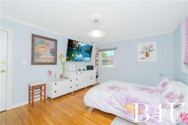 2544 E 64th St, Brooklyn, NY 11234 - bedroom with crown molding and light wood-style flooring