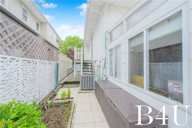 2544 E 64th St, Brooklyn, NY 11234 - view of patio / terrace featuring cooling unit and stairs