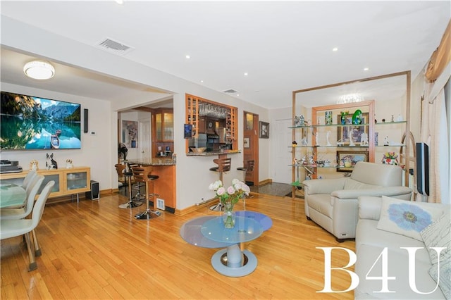 2544 E 64th St, Brooklyn, NY 11234 - living area with wood finished floors, baseboards, and recessed lighting