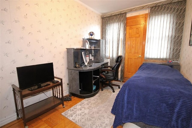 119 Langham St, Brooklyn, NY 11235 - bedroom featuring wallpapered walls, wood finished floors, and an office area