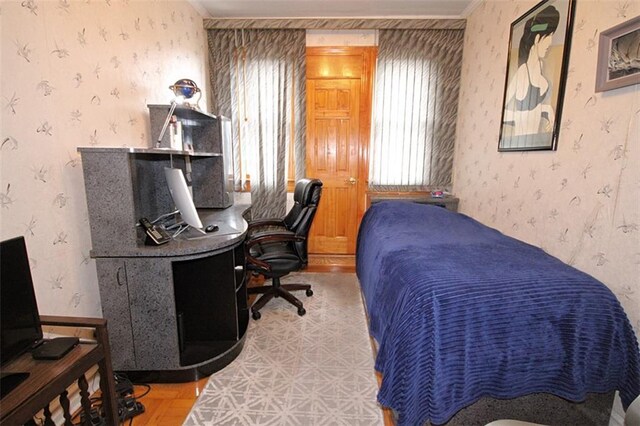 119 Langham St, Brooklyn, NY 11235 - bedroom featuring wallpapered walls, an office area, and wood finished floors
