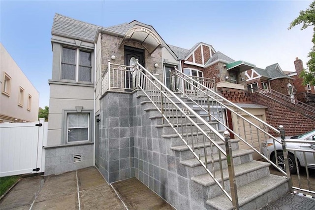 119 Langham St, Brooklyn, NY 11235 - view of front of home with roof with shingles