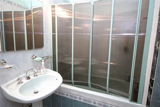 119 Langham St, Brooklyn, NY 11235 - full bathroom featuring a tile shower and tile walls