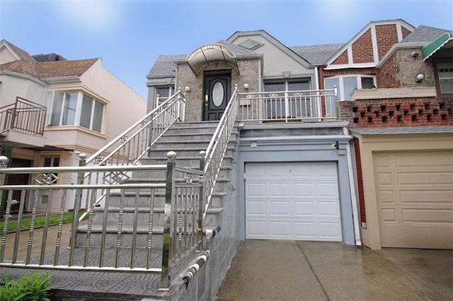 119 Langham St, Brooklyn, NY 11235 - multi unit property with driveway, a garage, stucco siding, and stairs