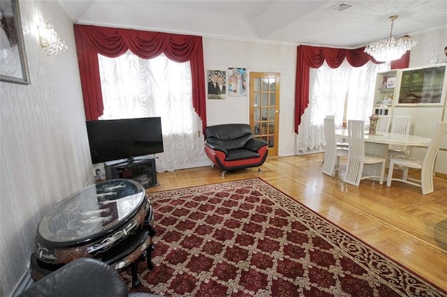 119 Langham St, Brooklyn, NY 11235 - living room featuring a chandelier and ornamental molding