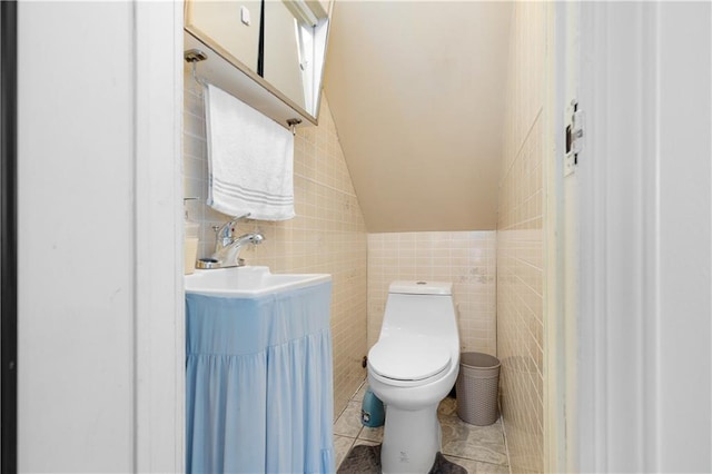 432 Neckar Ave, Staten Island, NY 10304 - half bathroom with tile walls, toilet, tile patterned floors, and a sink