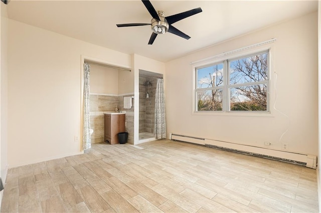 432 Neckar Ave, Staten Island, NY 10304 - unfurnished living room with a baseboard heating unit, light wood-type flooring, and a ceiling fan