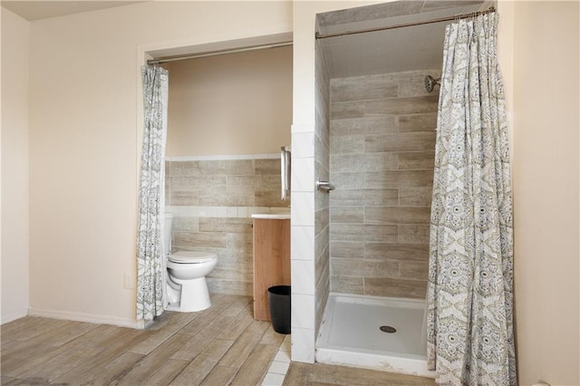 432 Neckar Ave, Staten Island, NY 10304 - bathroom featuring toilet, tile walls, a stall shower, wood finished floors, and vanity