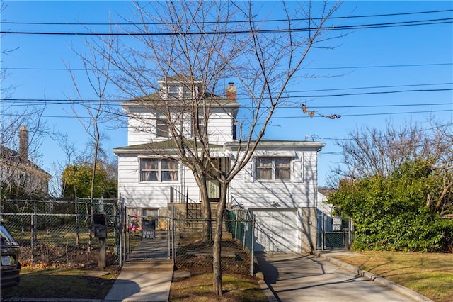 432 Neckar Ave, Staten Island, NY 10304 - view of front of home with a gate, an attached garage, a chimney, and concrete driveway