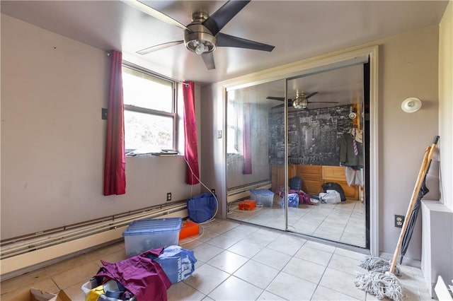 432 Neckar Ave, Staten Island, NY 10304 - interior space featuring a closet, light tile patterned flooring, a baseboard heating unit, and ceiling fan