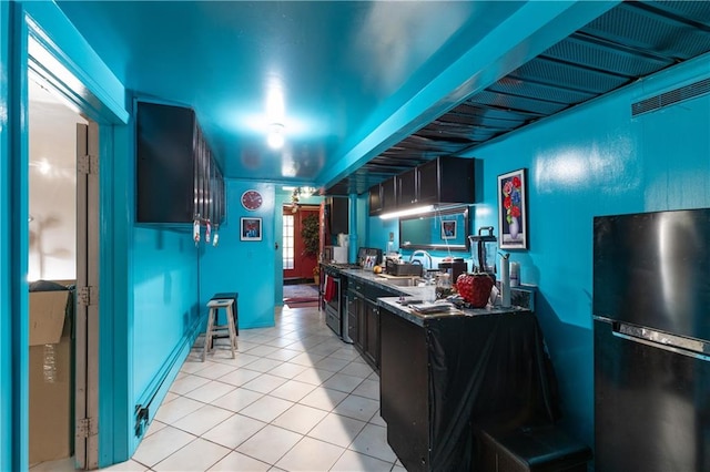 432 Neckar Ave, Staten Island, NY 10304 - kitchen with freestanding refrigerator, light tile patterned floors, stainless steel range with gas cooktop, and a sink