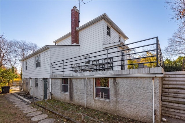 432 Neckar Ave, Staten Island, NY 10304 - rear view of property with a balcony, a chimney, and central AC