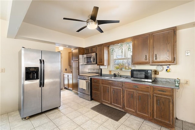 432 Neckar Ave, Staten Island, NY 10304 - kitchen with stainless steel appliances, a sink, ceiling fan, light tile patterned floors, and dark countertops