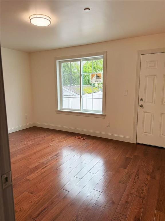 30 Church Ave, Staten Island, NY 10314 - unfurnished room featuring baseboards and dark wood-type flooring