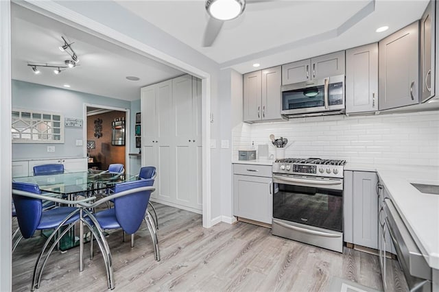 1929 E 36th St, Brooklyn, NY 11234 - kitchen with appliances with stainless steel finishes, gray cabinets, light wood-type flooring, light countertops, and recessed lighting
