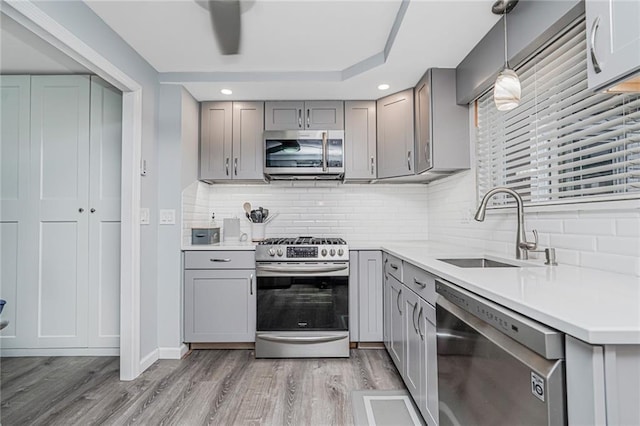 1929 E 36th St, Brooklyn, NY 11234 - kitchen featuring stainless steel appliances, gray cabinets, a sink, and recessed lighting