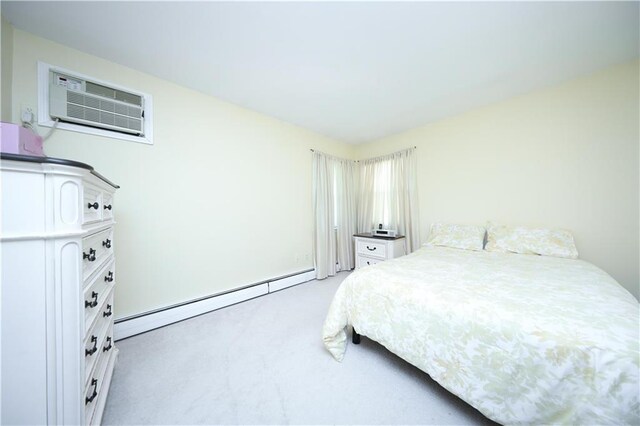 223 Abingdon Ave, Staten Island, NY 10308 - bedroom featuring a baseboard radiator, light carpet, and an AC wall unit