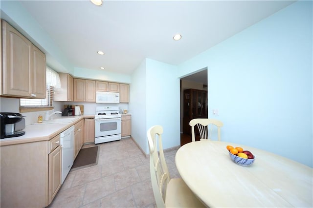 223 Abingdon Ave, Staten Island, NY 10308 - kitchen with white appliances, light brown cabinetry, a sink, light countertops, and baseboards