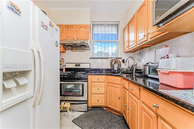 1922 E 16th St, Brooklyn, NY 11229 - kitchen with stainless steel appliances, exhaust hood, backsplash, and dark stone counters