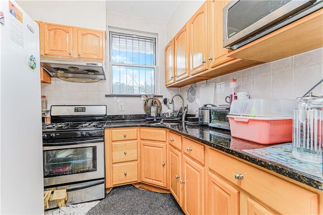 1922 E 16th St, Brooklyn, NY 11229 - kitchen featuring stainless steel appliances, extractor fan, dark stone countertops, decorative backsplash, and light brown cabinetry