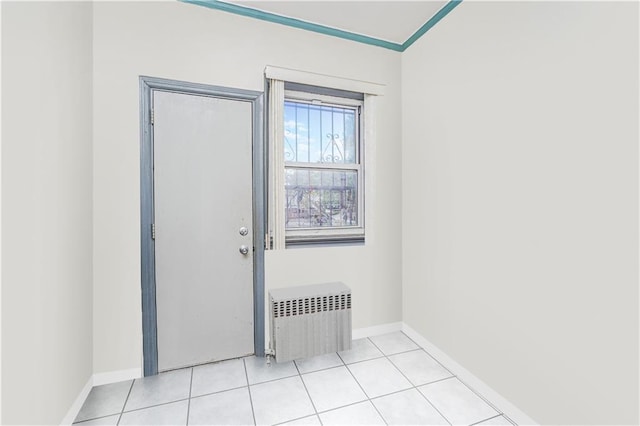 1922 E 16th St, Brooklyn, NY 11229 - unfurnished room with radiator, light tile patterned floors, and ornamental molding