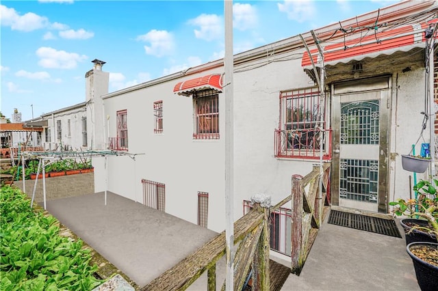 1922 E 16th St, Brooklyn, NY 11229 - view of home's exterior with stucco siding