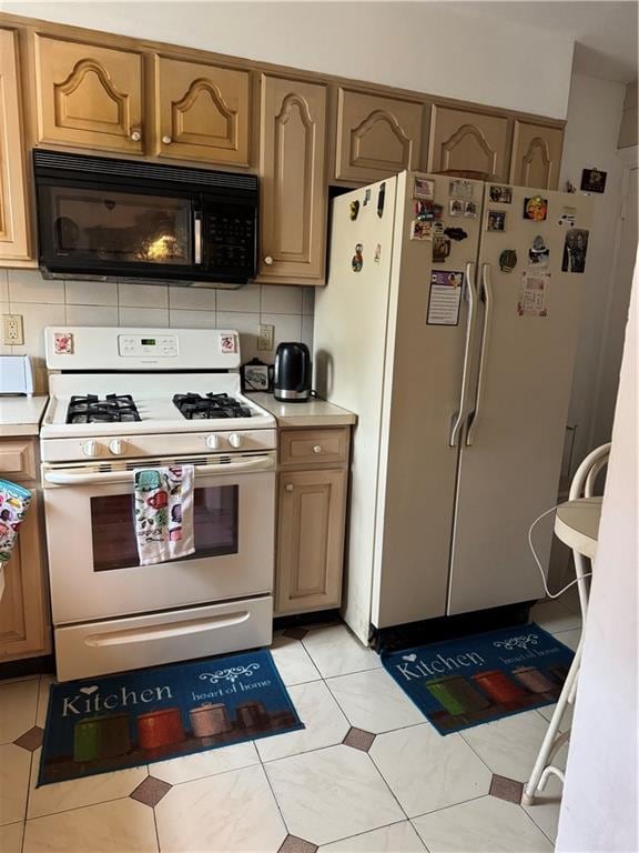 4515 Foster Ave, Brooklyn, NY 11203 - kitchen featuring white appliances, light countertops, light tile patterned floors, and backsplash