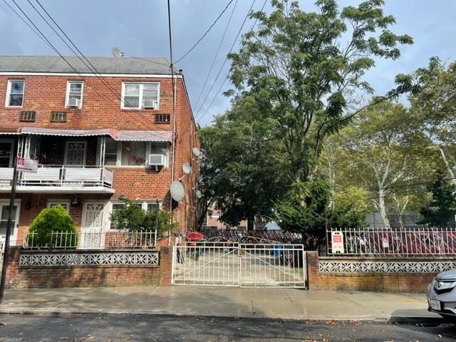 683 E 59th St, Brooklyn, NY 11234 - view of front facade featuring brick siding and a gate