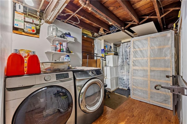 701 127th St, Queens, NY 11356 - laundry room with independent washer and dryer and wood finished floors