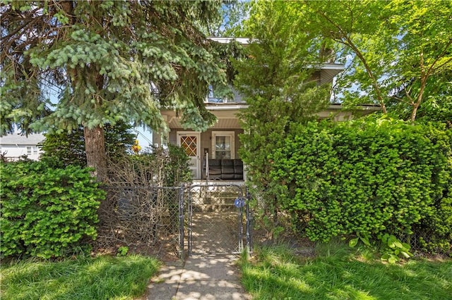 701 127th St, Queens, NY 11356 - obstructed view of property featuring a gate