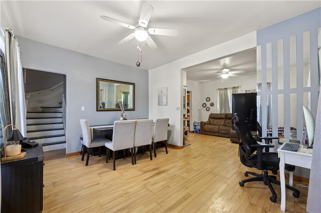 701 127th St, Queens, NY 11356 - home office featuring ceiling fan, light wood-type flooring, and baseboards
