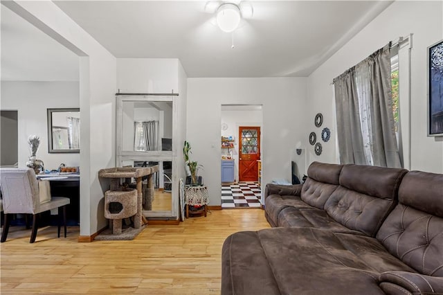 701 127th St, Queens, NY 11356 - living room with light wood-style flooring and ceiling fan