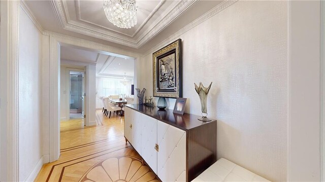 1311 Brightwater Ave Unit 8De, Brooklyn, NY 11235 - corridor with a chandelier, crown molding, and light wood finished floors